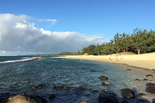 Beach of rocks and sand near Paia, Maui.