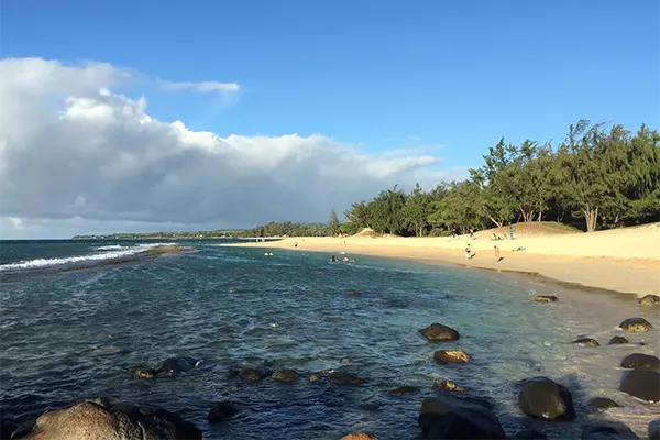 Beach of rocks and sand near Paia, Maui. 