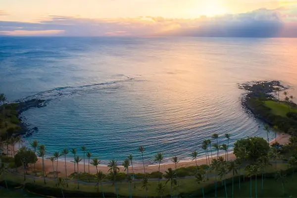 Aerial shot of Kapalua Bay in Maui during sunset. 
