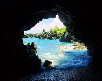 A sea cave during the day.