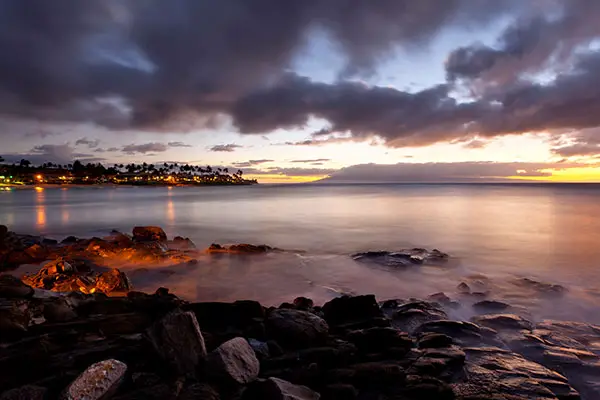 Path along the rocky coast at Napili Point at dusk in Maui, Hawaii.