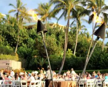Two tiki torches at a traditional luau on Maui.