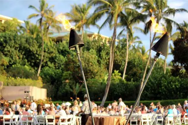 Two tiki torches at a traditional luau on Maui.