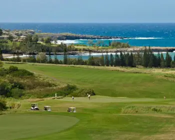 A picture of a golf course near the shore in Kapalua, Maui.