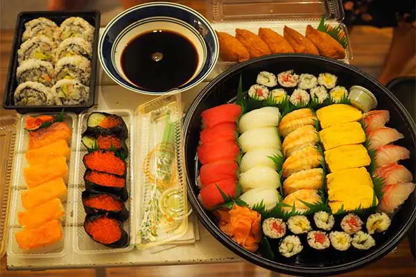 A serving plate of various sushi. 