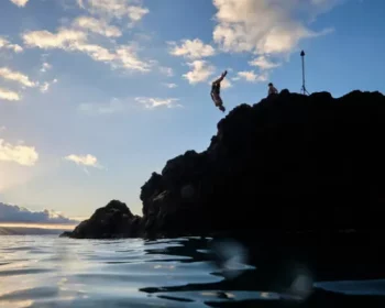 Diver jumping into ocean from Black Rock