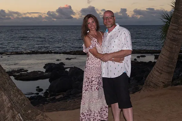 Couple taking a shot together in the evening on Maui. 