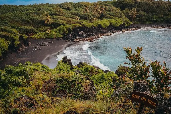 An aerial view of Maui's black sand beach. 