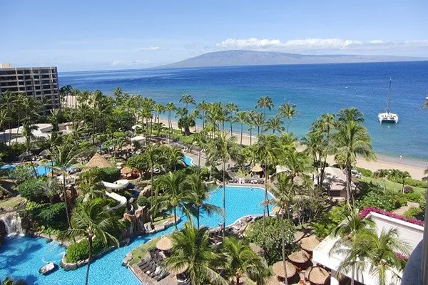 Aerial view of a resort in Maui by the ocean. 
