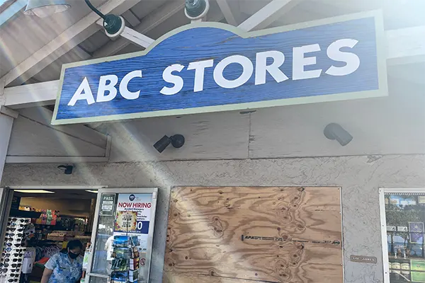 Outside a ABC Store in Maui, the wooden sign.
