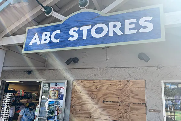 Outside a ABC Store in Maui, the wooden sign. 