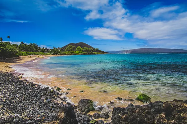 Tranquil turquoise-colored water on the quiet Maluaka Beach, Maui, Hawaii