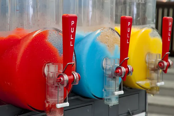 Slush puppies in their containers ready to be served. 