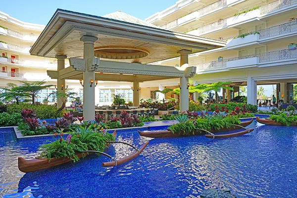 Resort fountain with decorative canoes. 