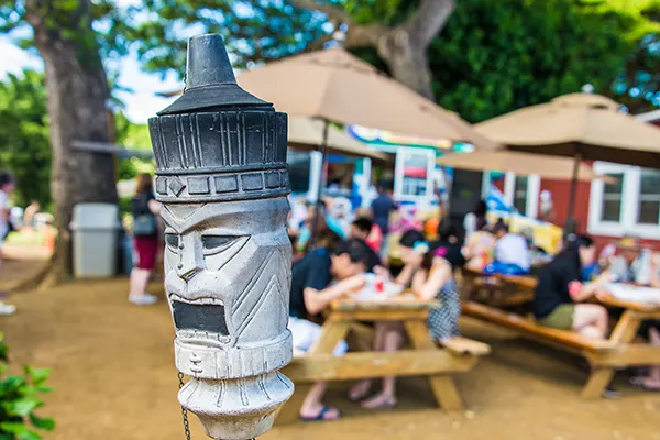 Hawaii mask sculpture near to the restaurant on the island of Maui.