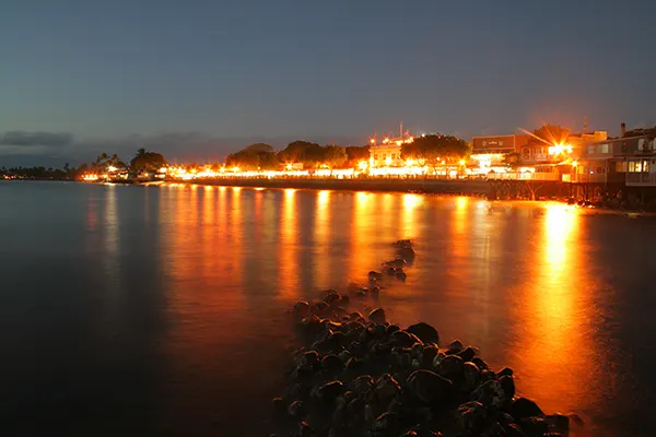 A town in West Maui at night. 