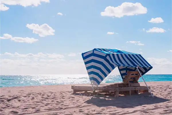 A cabana on the beach on a clear day. 