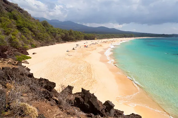 Makena Beach stretches towards the horizon in Maui. 