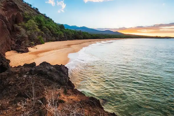 The beach in Kihei, Maui, at sunrise.