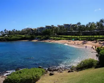 A beach in Maui with sapphire blue waters.