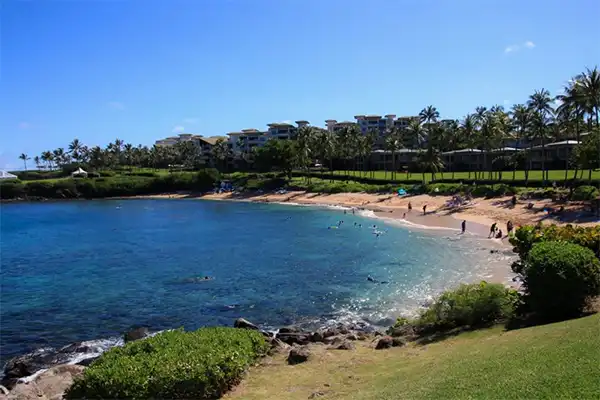 A beach in Maui with sapphire blue waters.