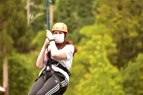 Woman ziplining in Maui. 